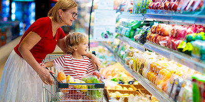 grandma and grand kid shopping at the grocery store