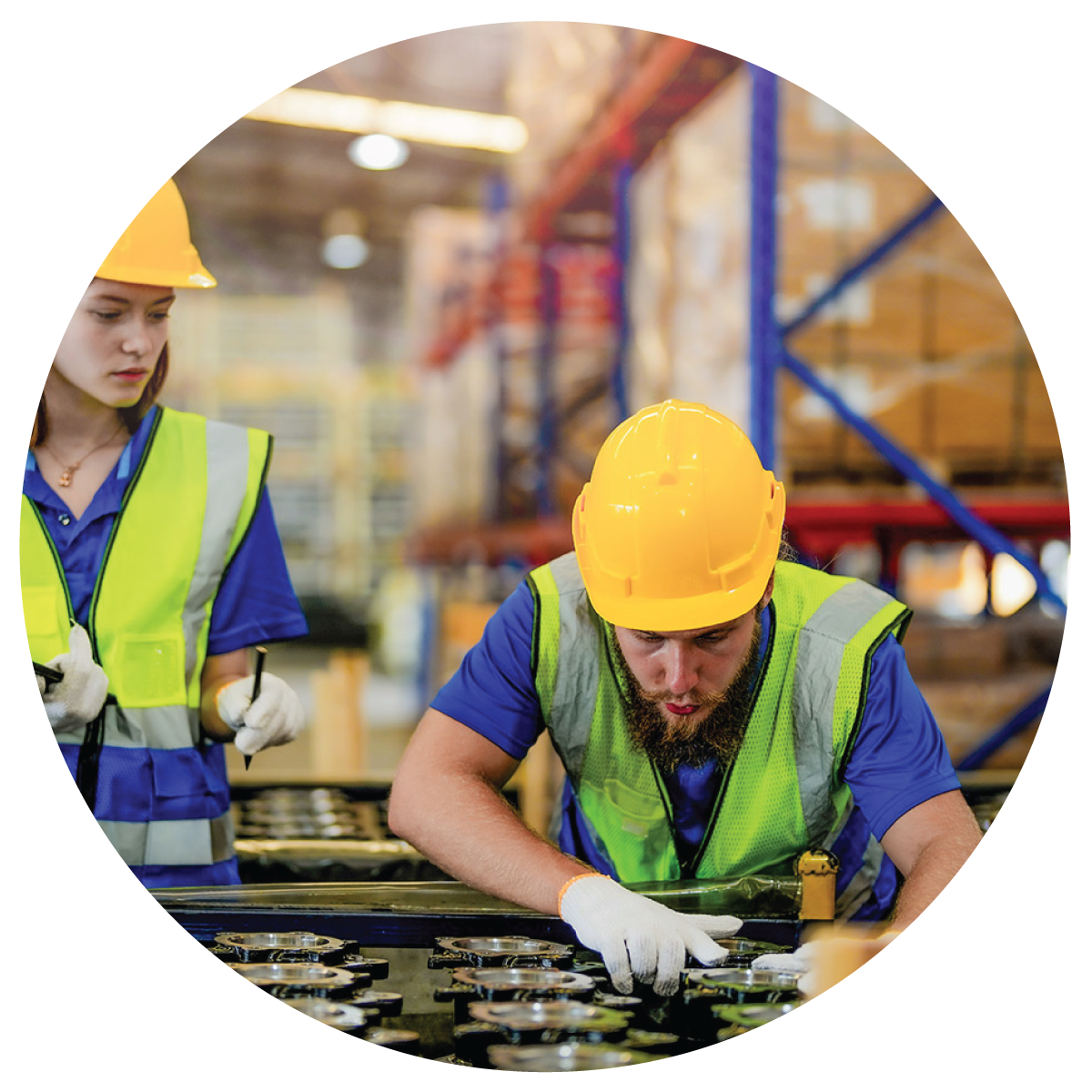 Two warehouse workers inspecting products for palletizing