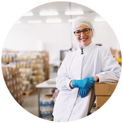 a person with PPE working in the food distribution warehouse